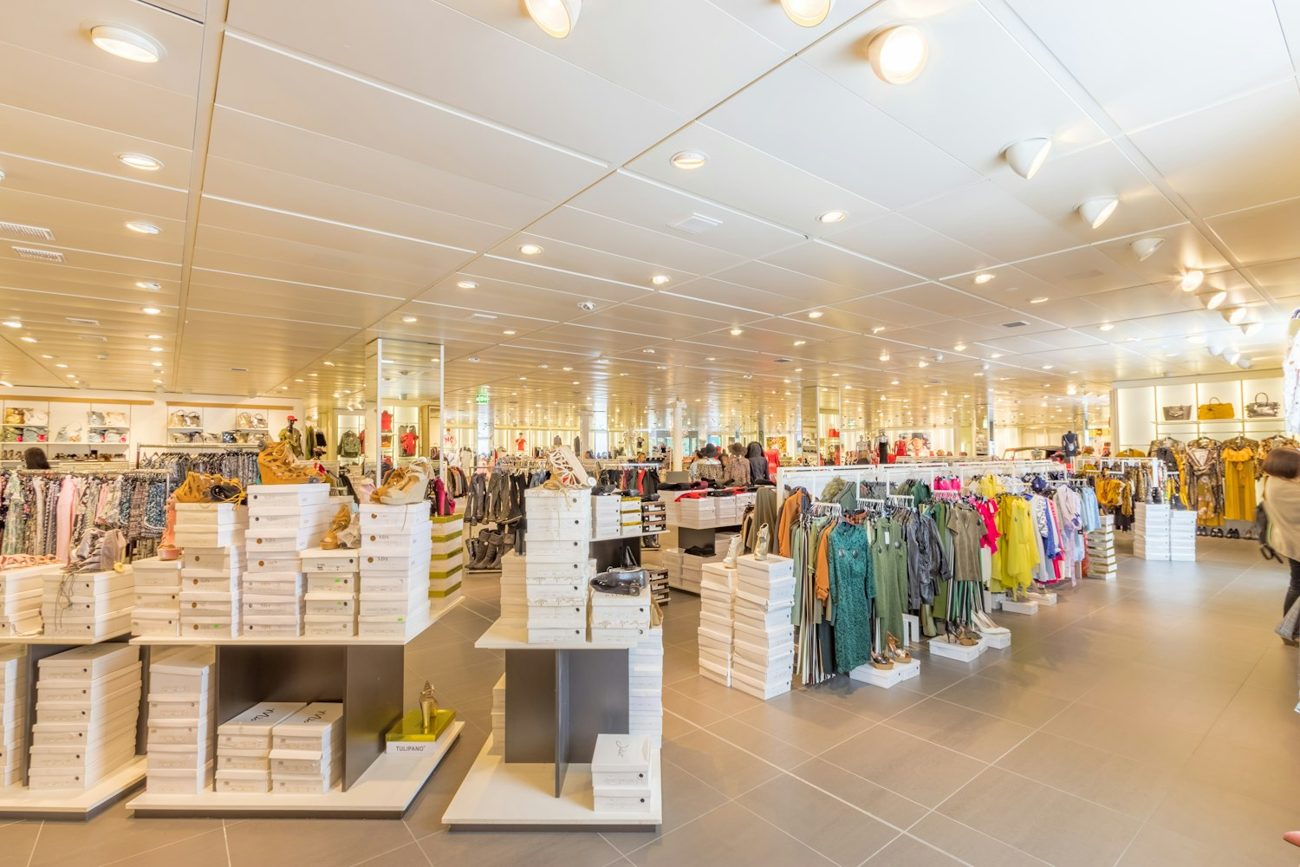 Retail showroom with SOLID LED downlights and track lights — commercial LED lighting Maharashtra